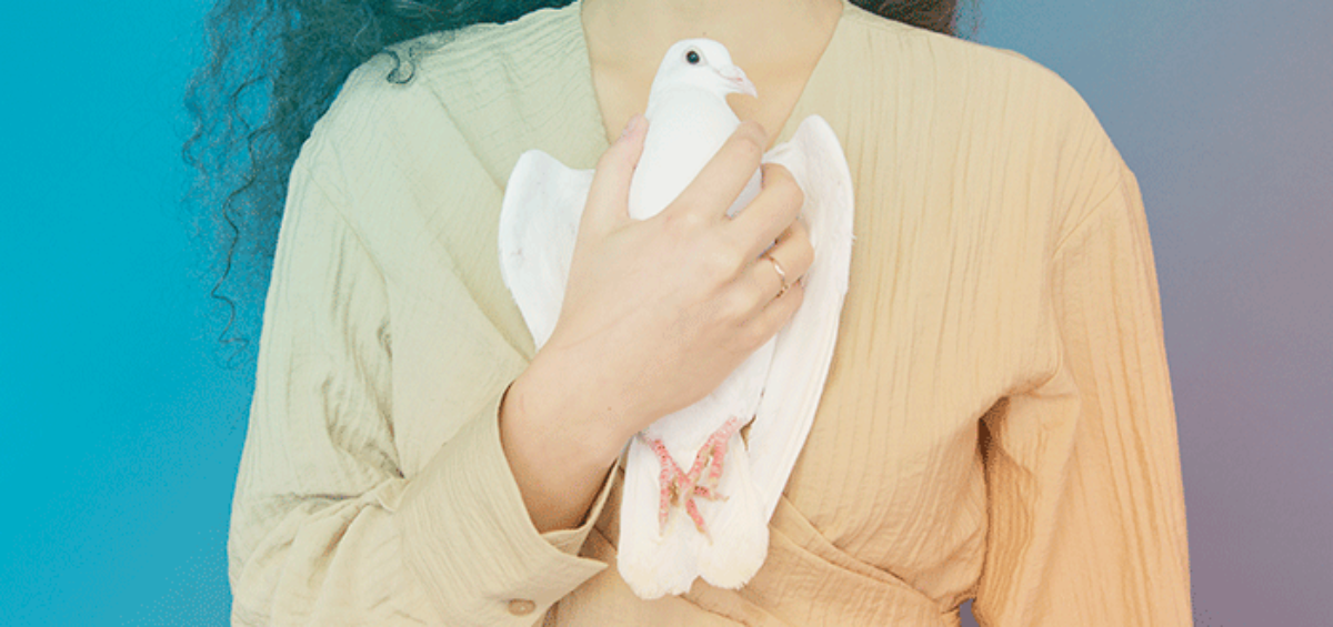 Woman Holding a Dove